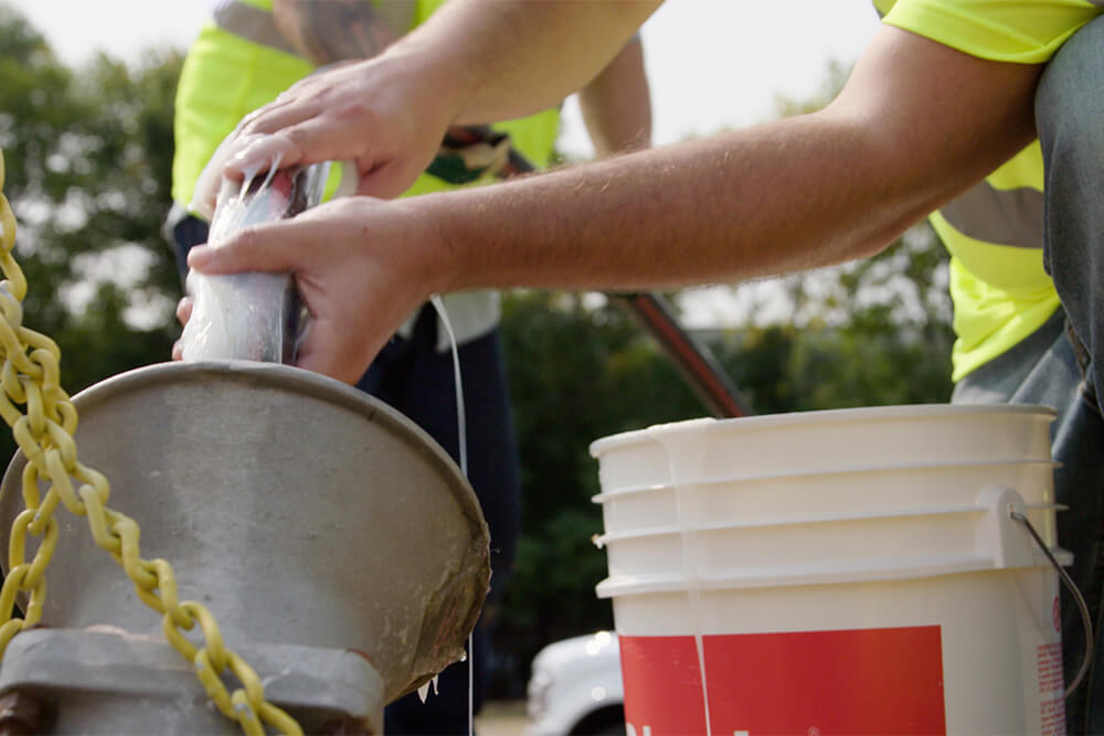 Polywater J lubricant being hand-applied to a cable