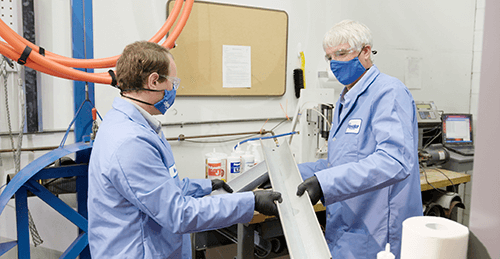 Two scientists testing conduit materials