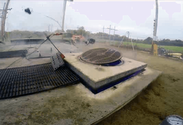 Testing a latched manhole cover during an explosion