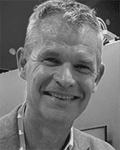 A headshot of Marcel den Haan