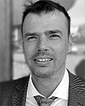 A headshot of Mikhail Dmitriev
